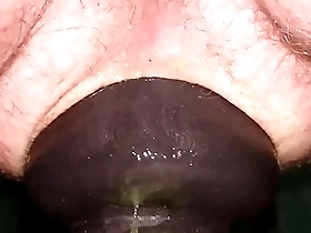 Huge 11cm wide butt plug sliding in my ass on toilet seat up close.